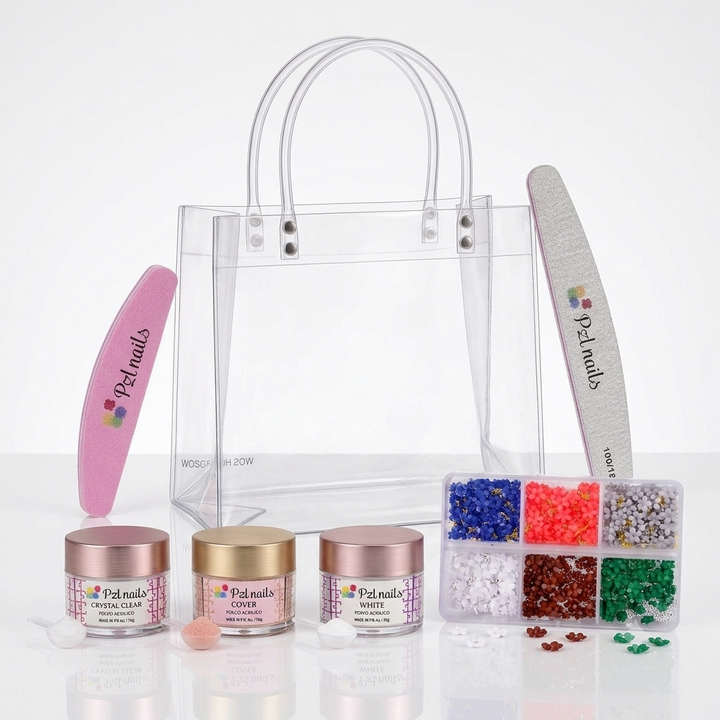 A nail art kit displayed on a reflective white surface, including a clear plastic bag, a pink nail file, a white nail file, three pots of nail powder (clear, glitter, and white), and a box of 3D resin flowers.