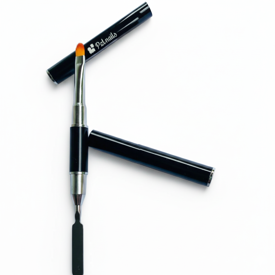 Makeup brush with black handle and red bristle tip on a white background