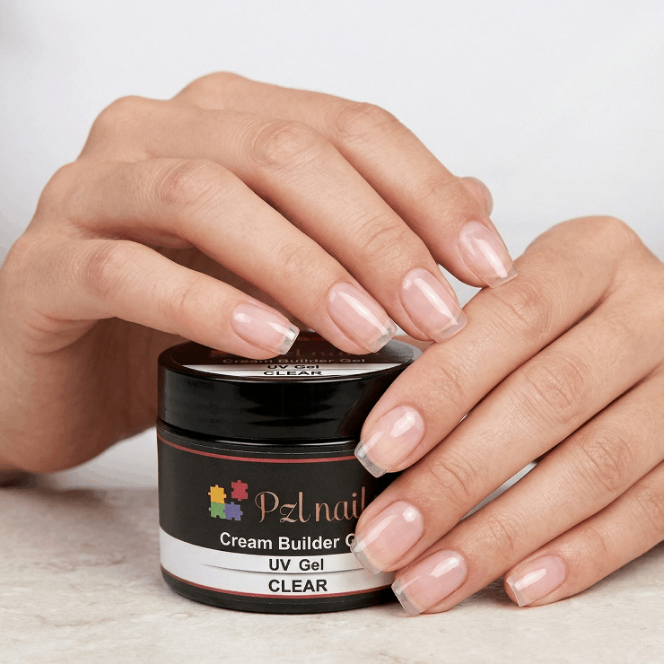 Person applying nail gel to their nails with a jar of PZL nail product.