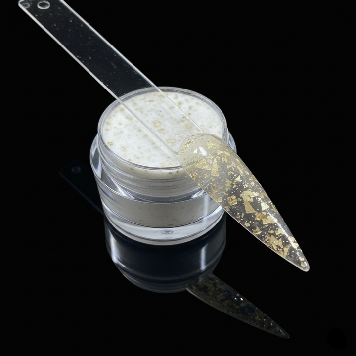 Clear container with white powder and a nail file on a black background