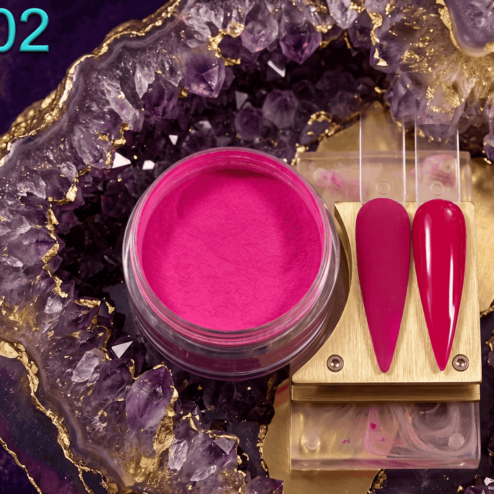 Pink makeup product with applicators on a decorative purple and gold background