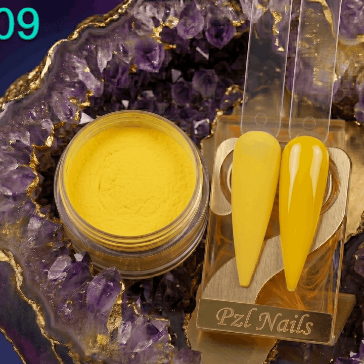 Yellow nail polish with applicators on a decorative purple crystal background